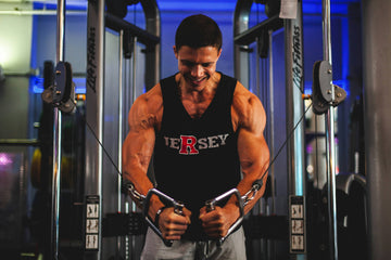 A person incorporating both cardio on a Wenoker treadmill and strength training with dumbbells in a home gym.